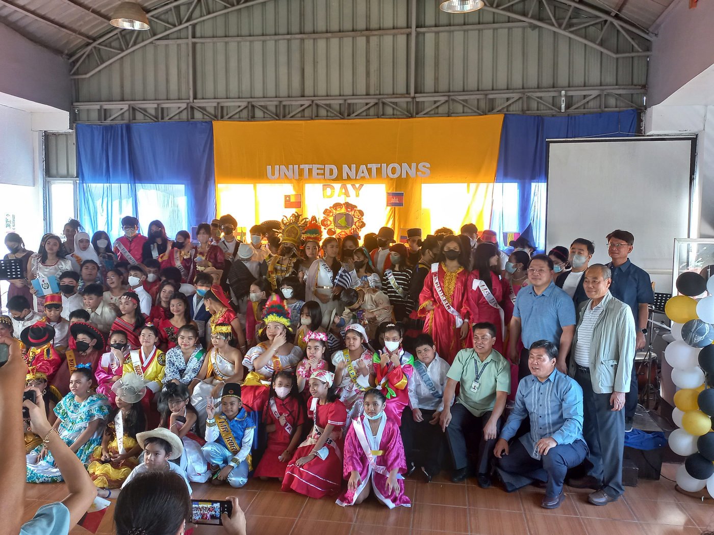 School community gathered for a United Nations Day celebration