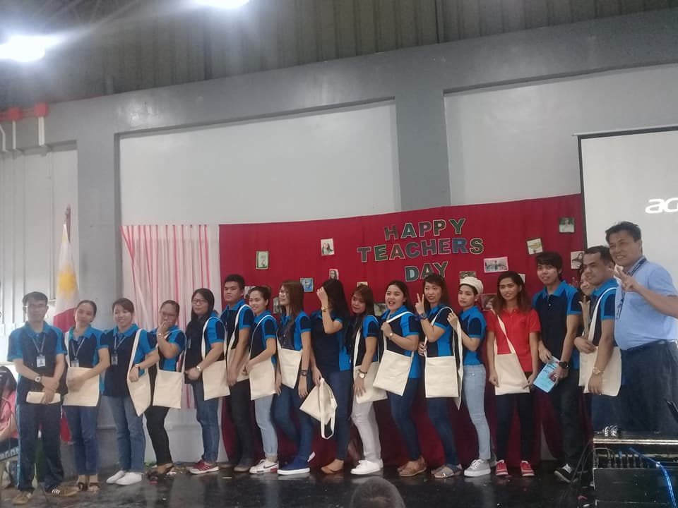 Teachers receiving certificates on stage