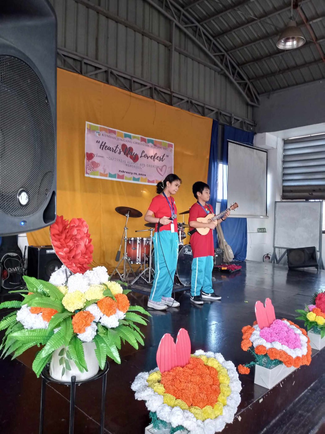 Pupils performing music on the Valentine's Day stage
